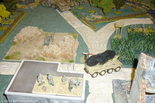 Late in Game 2 - the Sd.Kfz 234/3 has been knocked out, Platoon 2 in the wheat field has been eliminated, and Platoon 1 forward in the orchard is being pounded by Hunter's 95mm.