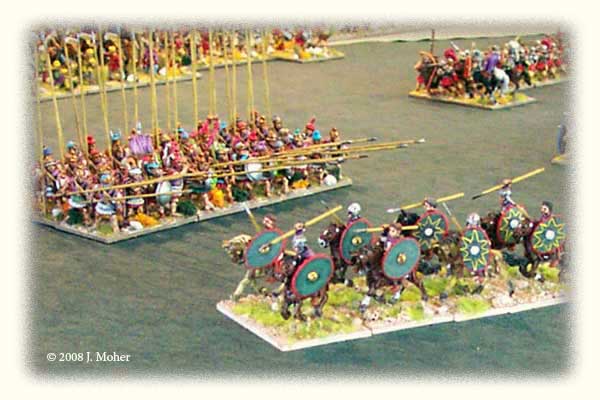 Anachronistic Ancient Battle: Late Imperial Roman Cavalry (350AD) ride past the opposing Macedonian Pikemen (320BC), supported by Early Imperial Roman Legionaries (100AD) at upper right.