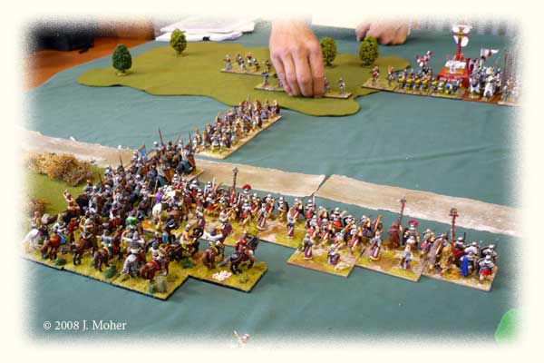 Pussy Footing Around - trying to get at the City Militia's flank without inciting the Swiss to action! A column of Auxilia heads into the woods, followed by the Armenian Cataphracts who hope to engage the Militia Spearmen frontally.