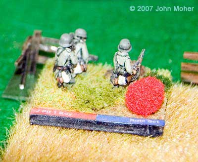 German Defenders, a Rifle Section from the 2nd Platoon of Kompanie 1. The red ball is a marker that denotes the stand has gone 'No Fire' through an unsuccessful reactive fire.