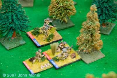 3 Platoon begin to move up through the centre of the wood.