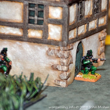 Chosen Man Patrick Harper moves into the Farmhouse Doorway Chosen Man Patrick Harper moves into the Farmhouse Doorway under intermittent fire from the Poles.