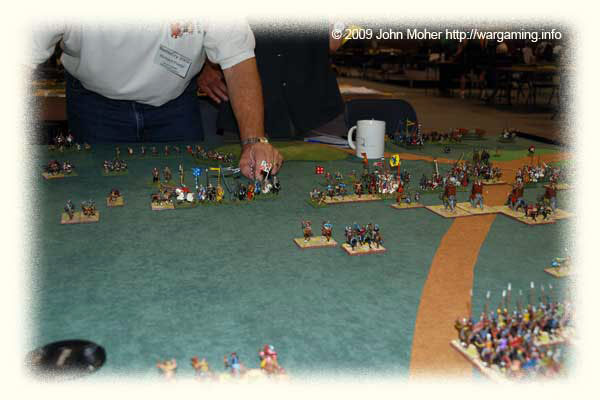 Later - the Centre & Centre-Left is getting pretty barren (on both sides) - there are casualties aplenty everywhere and both armies are taking a bit of a pounding! My Cataphracts are at the bottom right of picture and still haven't advanced into the fight - the risk of deploying back in depth then getting low PiPs at critical moments... Later - the Centre & Centre-Left is getting pretty barren (on both sides) - there are casualties aplenty everywhere and both armies are taking a bit of a pounding! My Cataphracts are at the bottom right of picture and still haven't advanced into the fight - the risk of deploying back in depth then getting low PiPs at critical moments...
