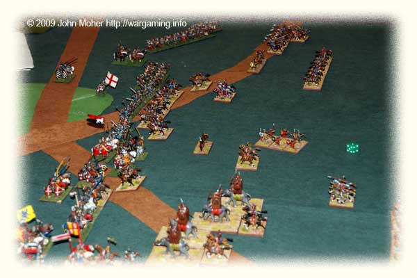 The Centre-Right and Right later in the game - the Kushan Elephants are finally coming into action, and on the far right Campbell has lost a couple of Kn(X) to the mass of English Longbowmen in a failed attempt to threaten their flank. The Centre-Right and Right later in the game - the Kushan Elephants are finally coming into action, and on the far right Campbell has lost a couple of Kn(X) to the mass of English Longbowmen in a failed attempt to threaten their flank.