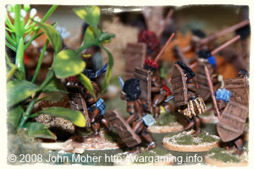 Darkest Africa Tribesmen move through the jungle.