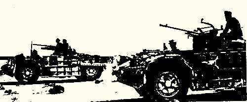 A pair of "Sahariane" on patrol in North Africa. These are probably from the first unit formed - the "Raggruppamento Sahariano AS" and provide excellent details of the vehicles. The closest vehicle mounts the Breda 20mm L/65 AA Gun (which was used as a dual purpose weapon and usually engaged ground targets), while the further one mounts the 47mm L/32 Gun (the same gun as used by Infantry and Anti-Tank Gun units, and mounted in the M13 & M14 Medium Tanks). Both vehicles clearly display the stowage arrangement with racks of "Jerry Cans" along the sides, and sand chutes can be seen hanging above the rear wheel of the further vehicle. The typical crew of 3-5 men is clearly evident, the drivers position at the extreme front of the vehicle clearly visible. A pair of "Sahariane" on patrol in North Africa.