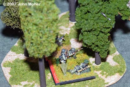German Rifle Section and PC discovered by RBF - they are entrenched (we forgot to put the entrenchment on the table for this photo). They were soon targeted by mortar fire and directly by the 2 Rifle Sections of No.3 Platoon. German Rifle Section and PC discovered by RBF - they are entrenched (we forgot to put the entrenchment on the table for this photo). They were soon targeted by mortar fire and directly by the 2 Rifle Sections of No.3 Platoon.