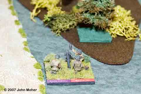 A 3" Mortar Section goes into action supporting the advance. A 3" Mortar Section goes into action supporting the advance.