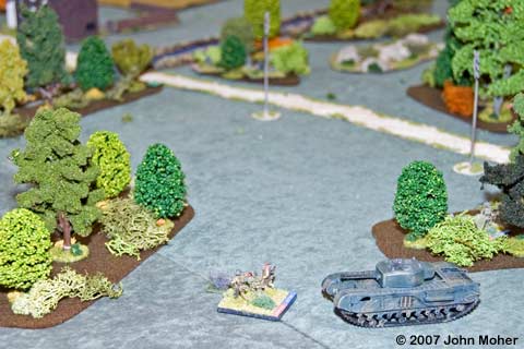 A Churchill moves up to support a Squad from 2 Platoon who have gotten pinned in the open. The firer (an MMG) is over beyond the Highway (behind the telegraph pole) on the British right flank. A Churchill moves up to support a Squad from 2 Platoon who have gotten pinned in the open. The firer (an MMG) is over beyond the Highway (behind the telegraph pole) on the British right flank.