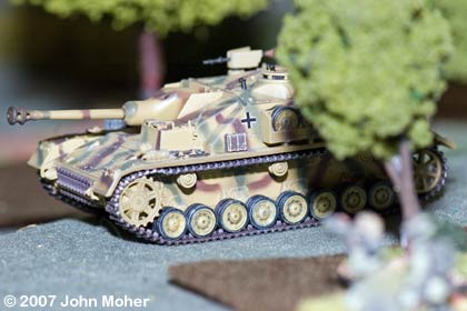 StuG IV moves up to bombard the first building. StuG IV moves up to bombard the first building.